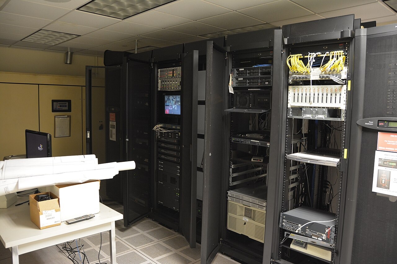 File photo: Server racks and network equipment in a server room. Illustrative context; not a photograph of the reported event.