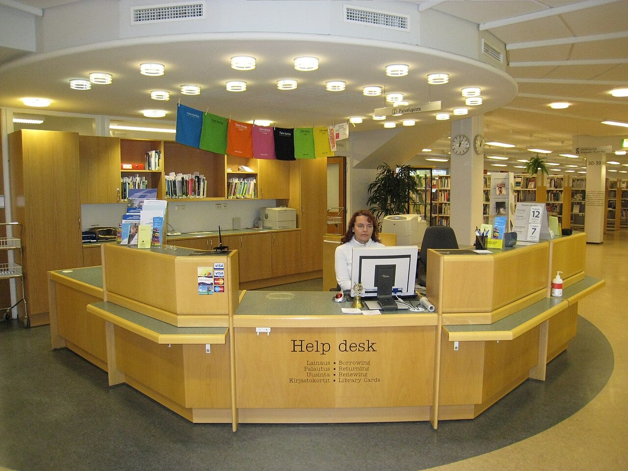 File photo: A library help desk with a staff member and computer terminal at Seinäjoki University of Applied Sciences' Campus Library. Illustrative context; not a photograph of the reported event.